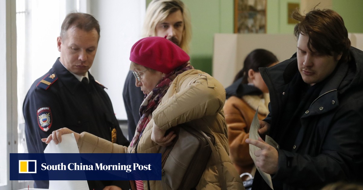 Putin tightens grip on Russia in election though thousands join noon protest