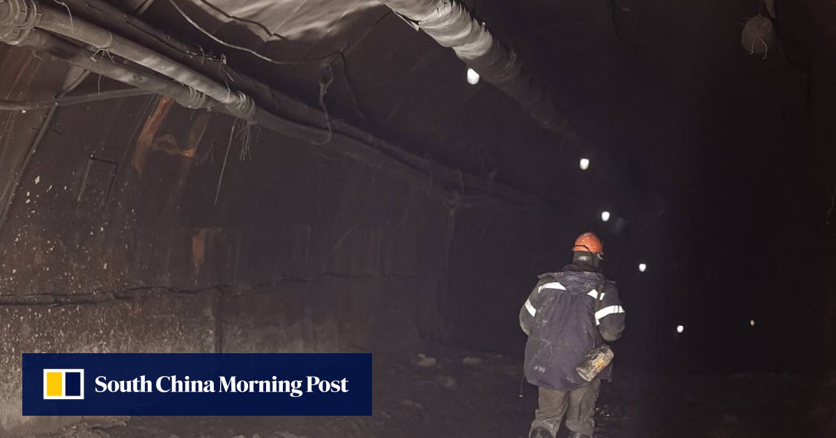Russian rescuers scramble to save 13 trapped under gold mine