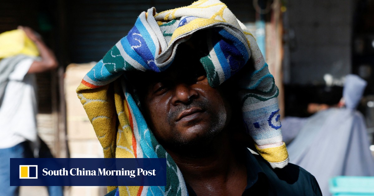 India’s capital hits record 52.3 degrees in fierce heatwave: ‘everyone wants to stay indoors’, ‘waiting for the monsoon’