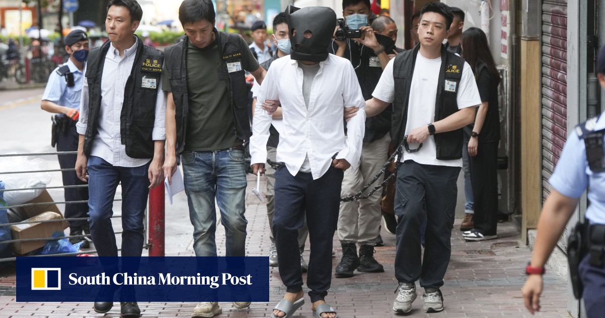 Suspect takes part in police re-enactment of fatal hammer attack in Hong Kong