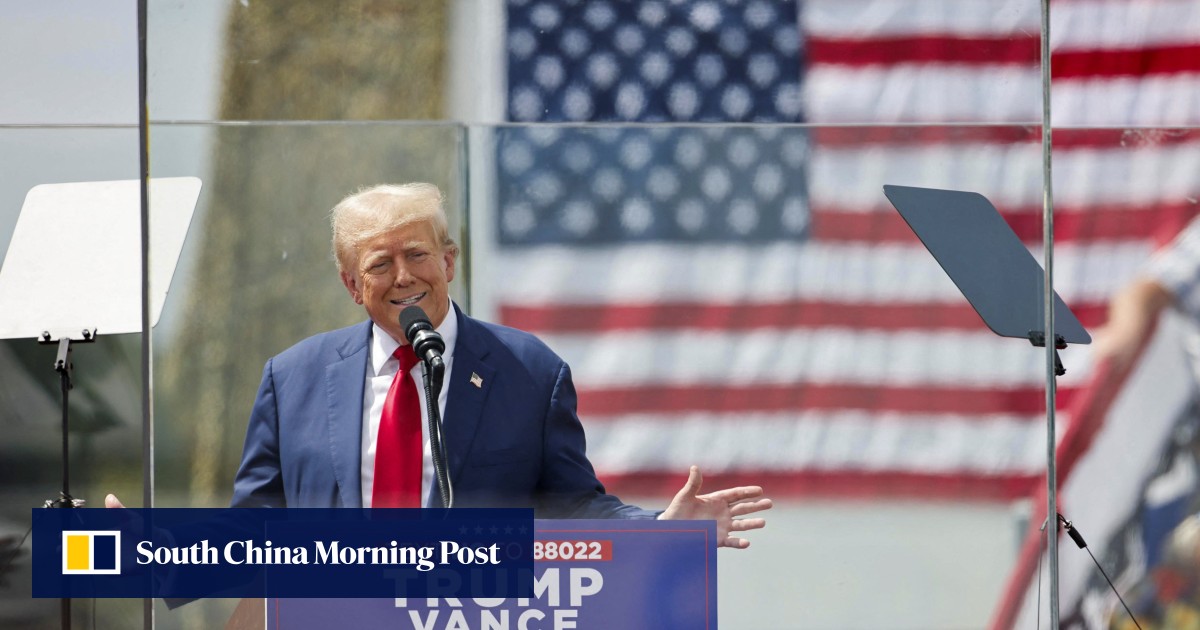Behind bulletproof glass, Donald Trump holds 1st outdoor rally since assassination bid