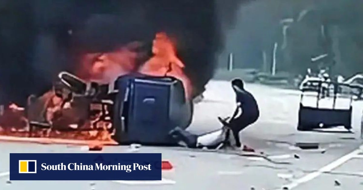 China Rip Entry China hero rips open door of burning car, saves injured driver moments ...