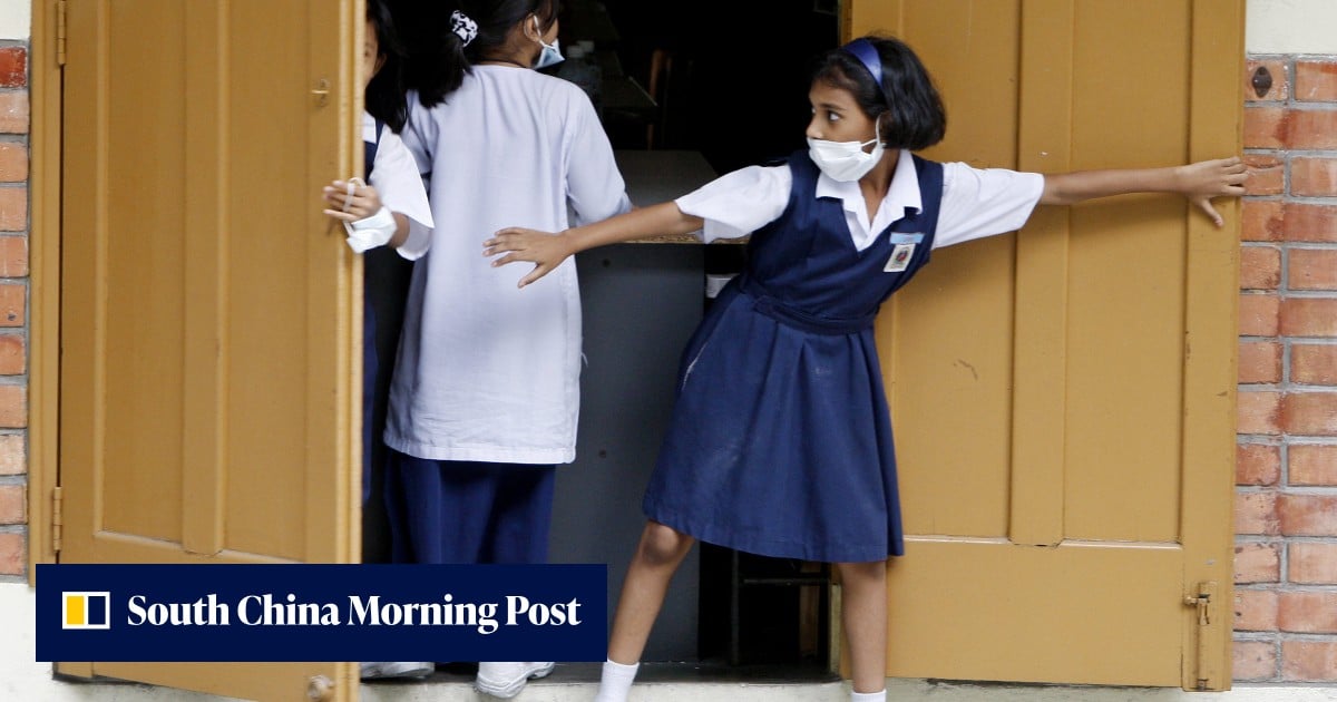 Malaysia battles influenza outbreak as schools close before crucial exams