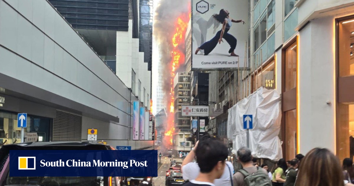 Firefighters battle blaze at Chinachem Tower in Hong Kong, 3 trapped in lift