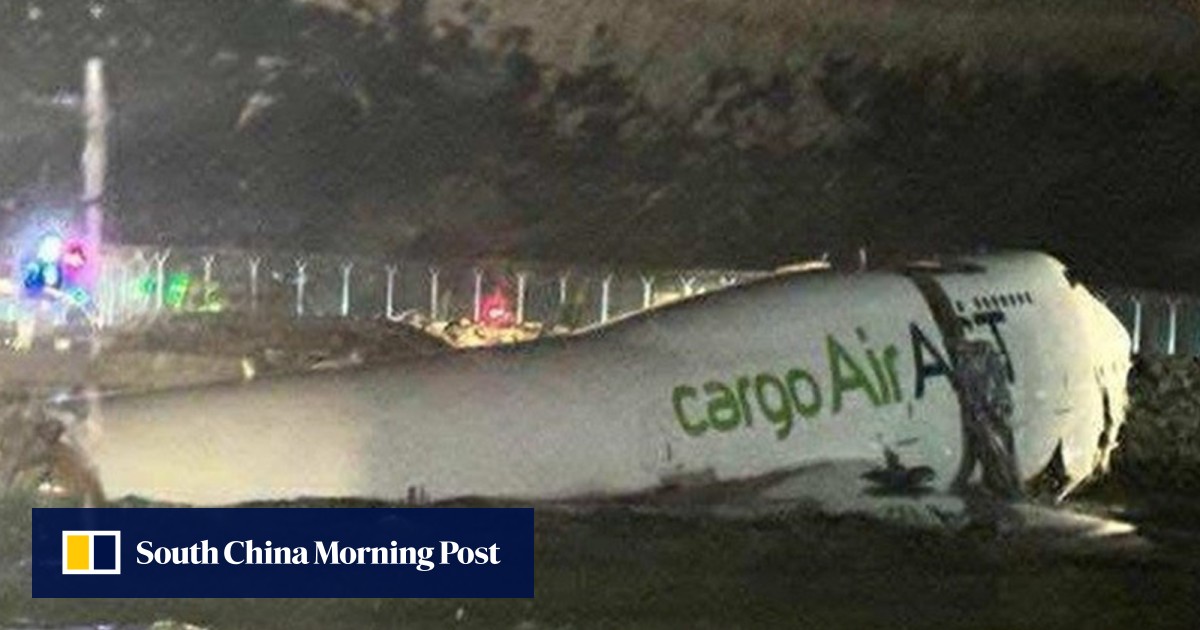 2 dead after Emirates plane slides off Hong Kong runway, apparently hits ground vehicle