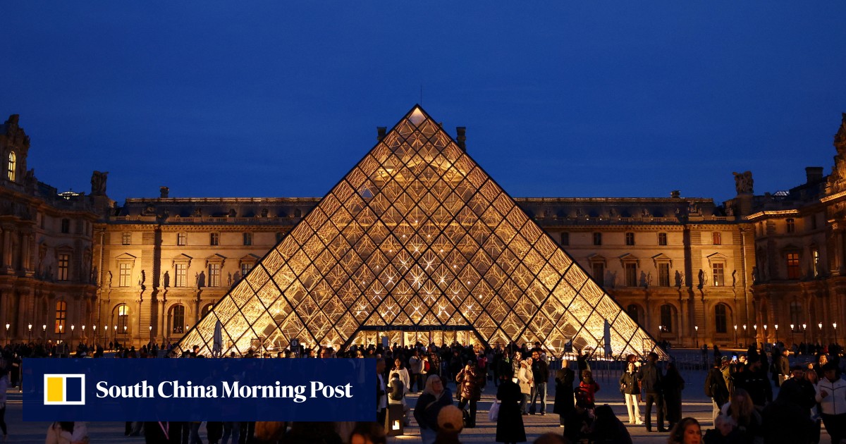 Woman charged over Louvre heist tears up in court