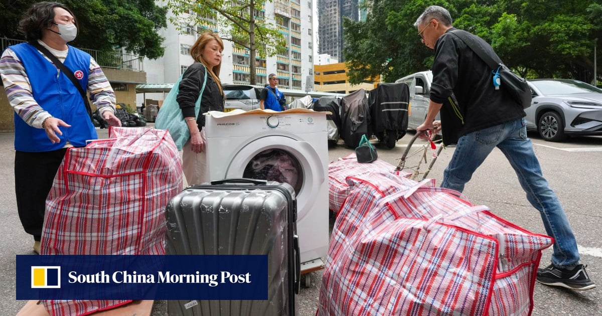 Residents of sole block spared in Hong Kong fire return home to collect essentials
