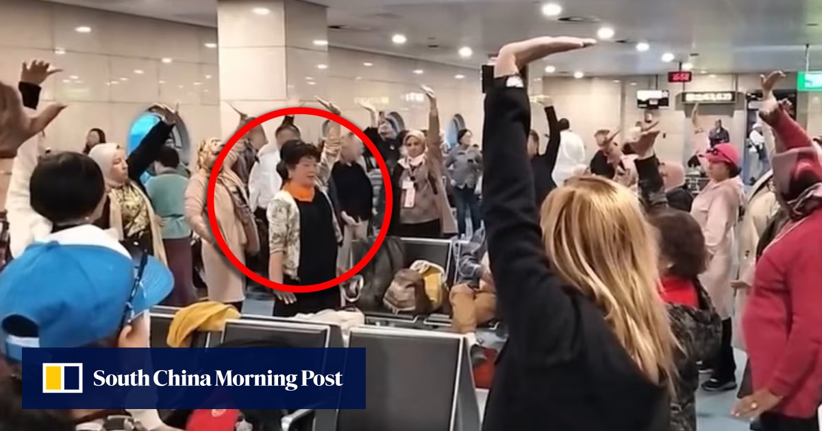 China aunties teach qigong exercises to fellow passengers at Cairo airport during flight delay