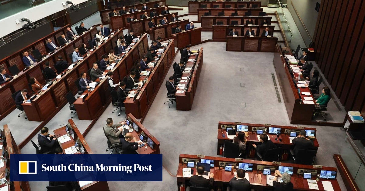 Hong Kong’s finance chief warns of market volatility, pledges support for families