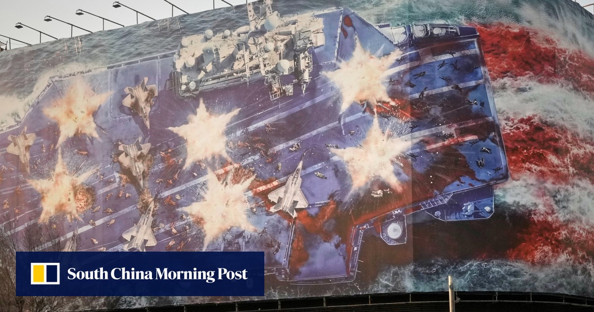 Iran unveils bloody anti-US billboard as carrier force nears