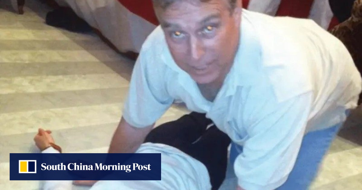 New Epstein photos show ex-prince Andrew on all fours over woman on the floor