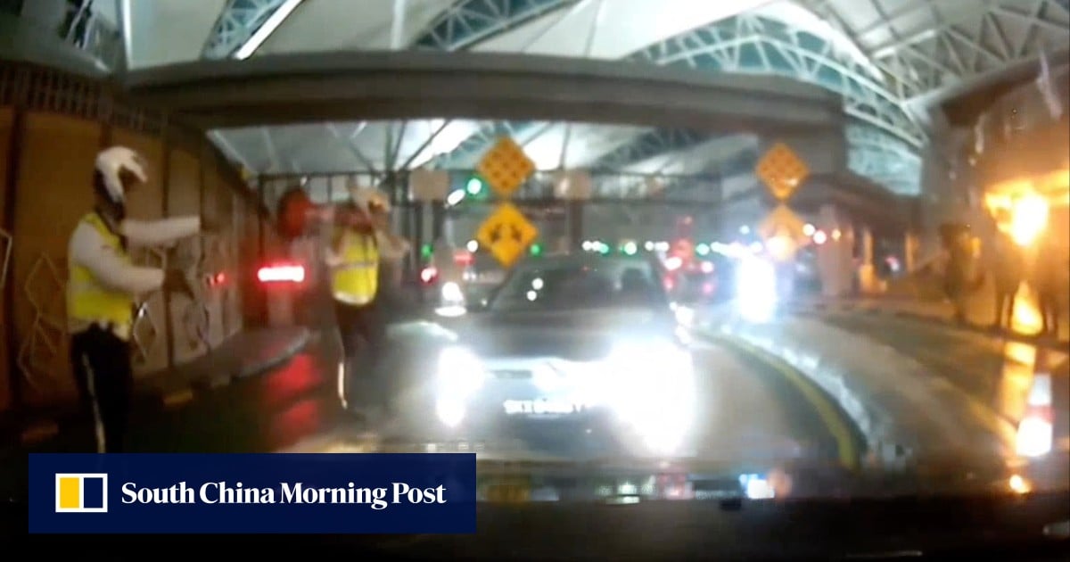 Malaysian police draw gun in stand-off with Singapore car driving wrong way at checkpoint