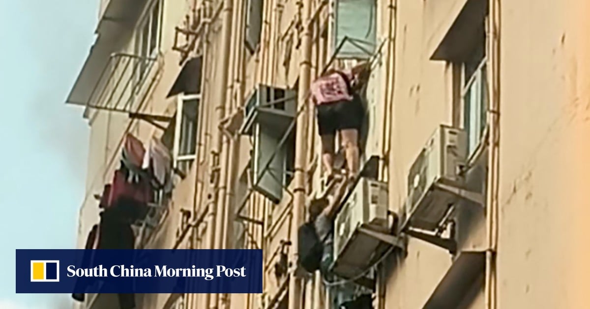 2 women climb out of window to flee Hong Kong building fire that injured 3 others