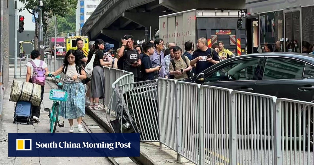 Hong Kong police searching for driver on the run after hitting railing and bus