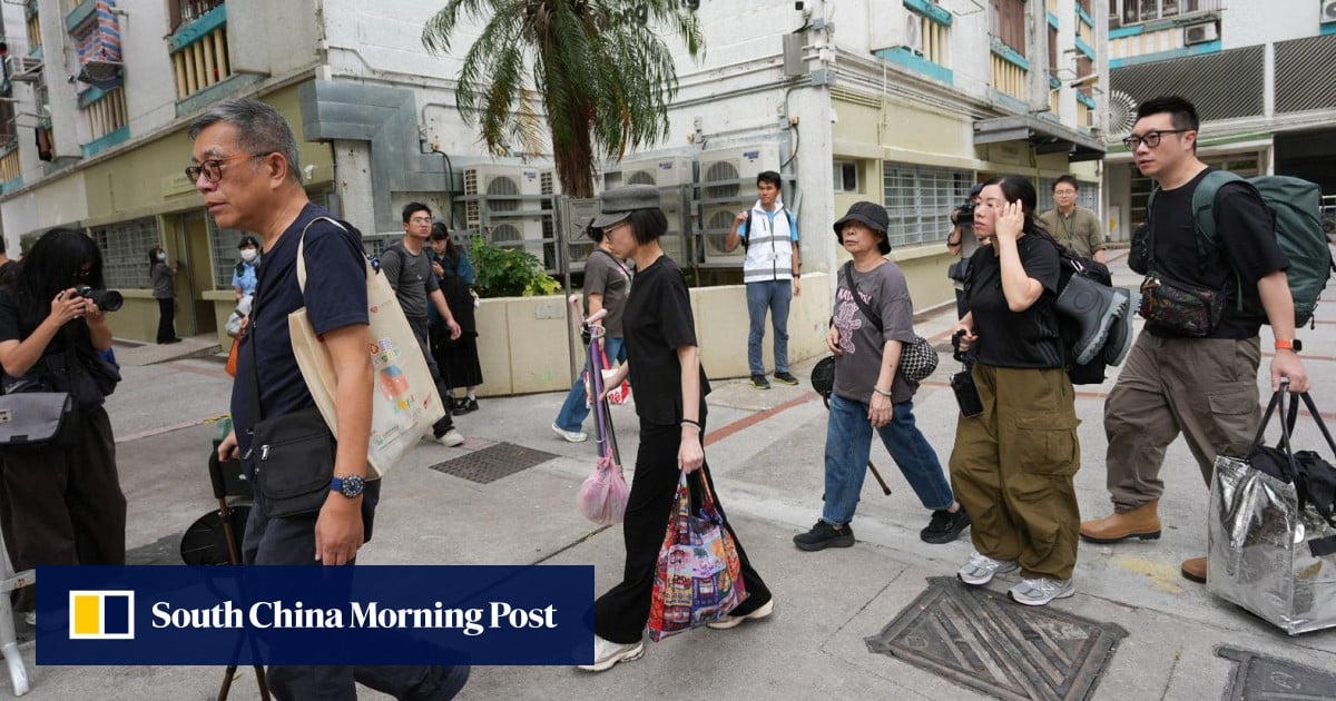Residents leave prayers and flowers on third day of return to Wang Fuk Court