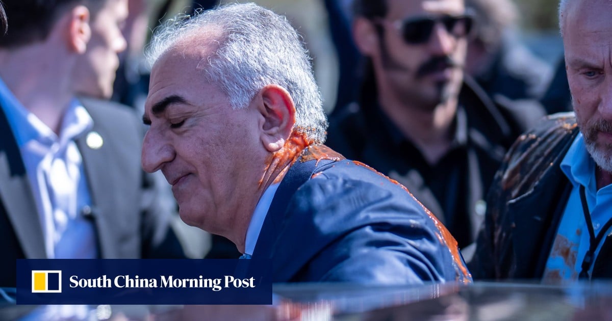 Iran’s exiled crown prince Pahlavi splashed with red substance in Berlin