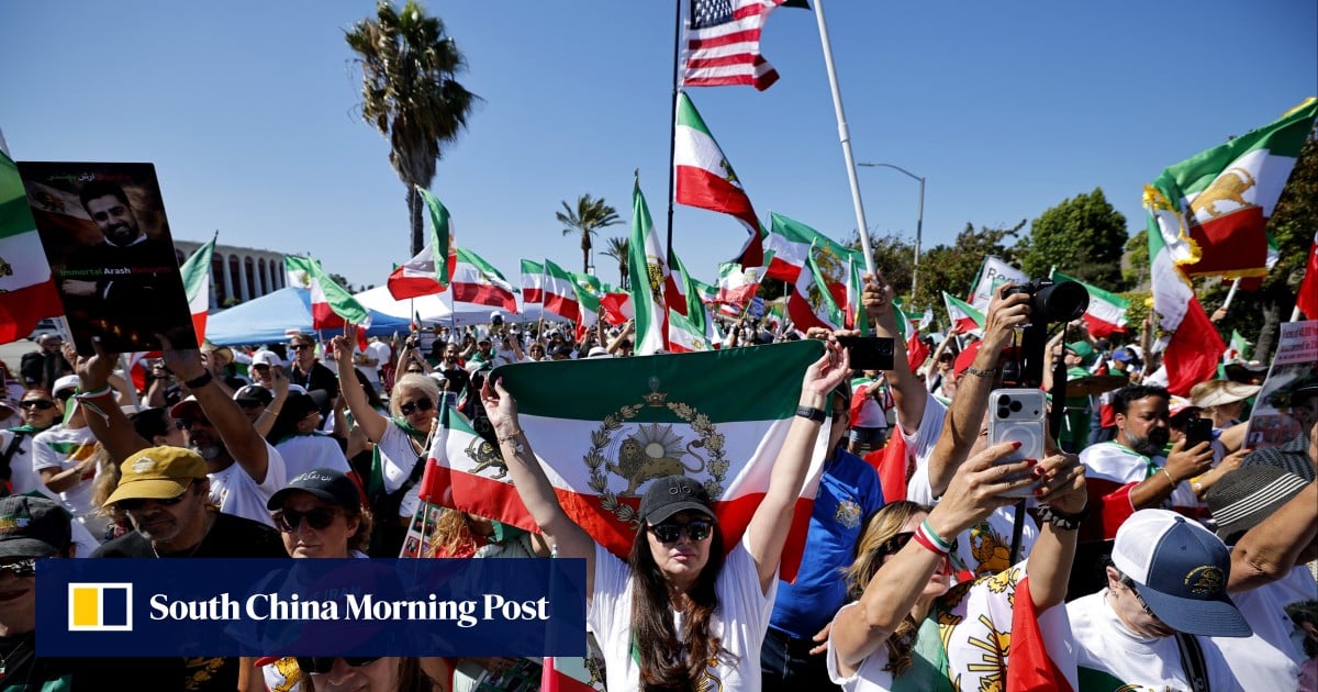 Iranian American protesters gather as football team prepare for World Cup opener