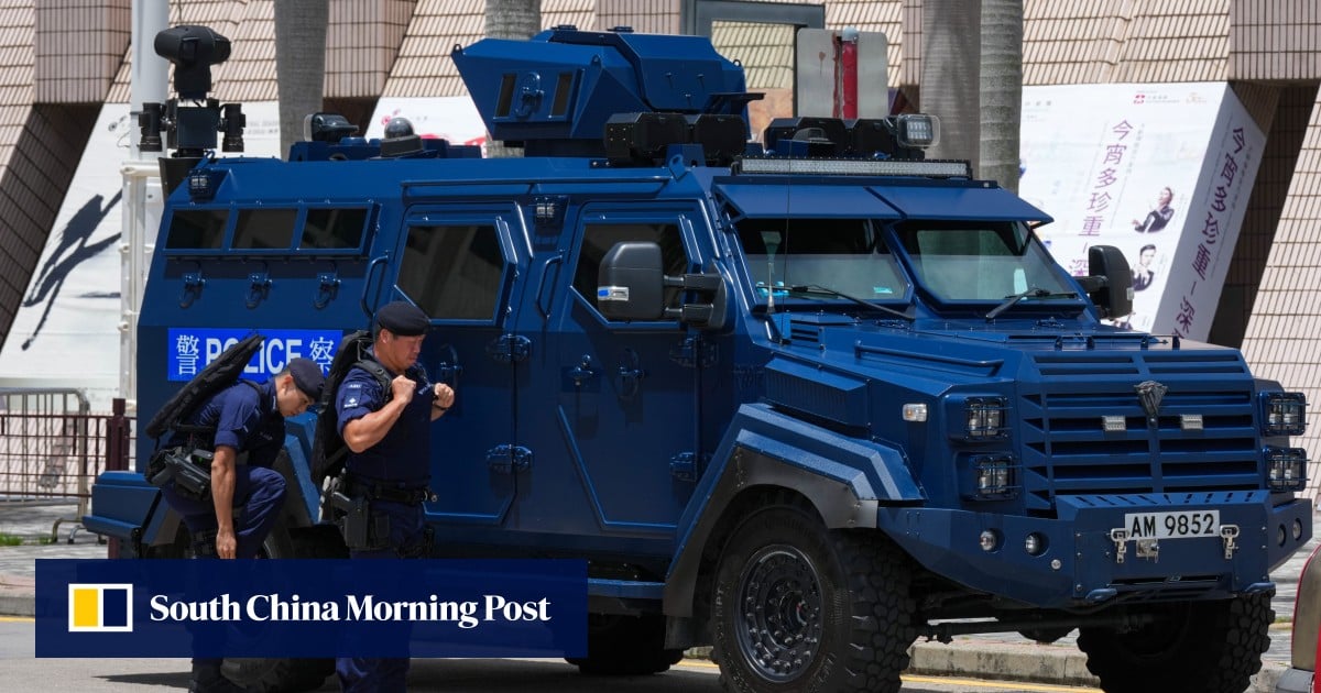 Hong Kong police search 15 in former July 1 protest areas, man taken away