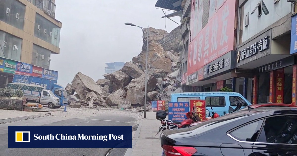 Rescuers in China race to reach residents trapped by landslide that has killed 8 people