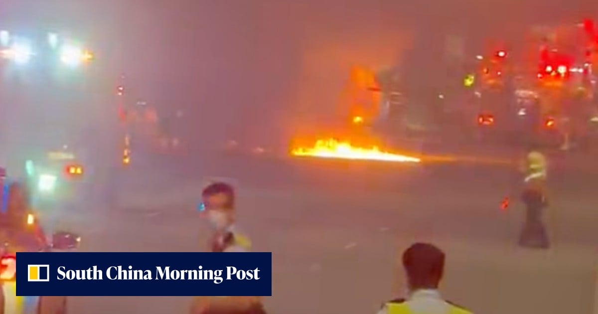 Truck driver flees after vehicle crashes and bursts into flames on Lantau highway