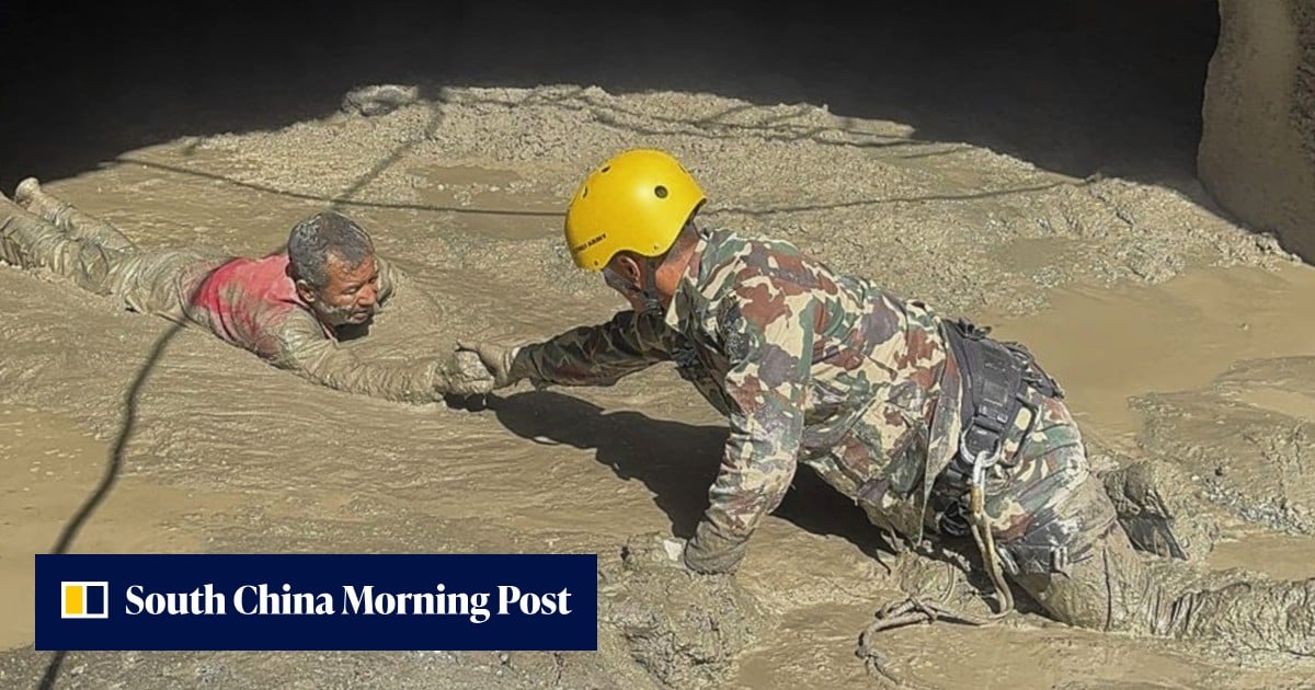 Nepal floods: rescuers send air pipe into tunnel with trapped workers
