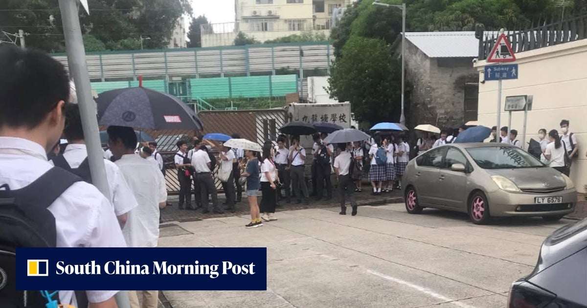 Education Bureau steps in after students wait in rain for uniform and hair checks