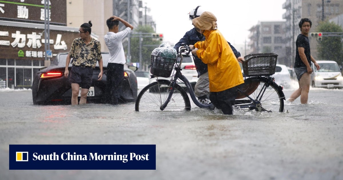 Japan’s Nagoya reels from record rain, stranding commuters and flooding city