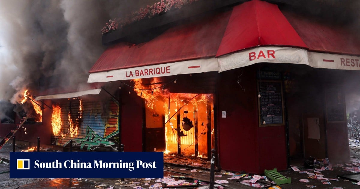 Night of violence lingers over Paris as one Chinese cafe owner counts the costs