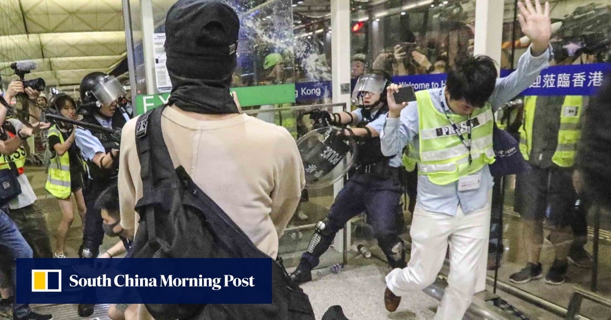 Riot police, protesters clash in unprecedented violence at Hong Kong airport