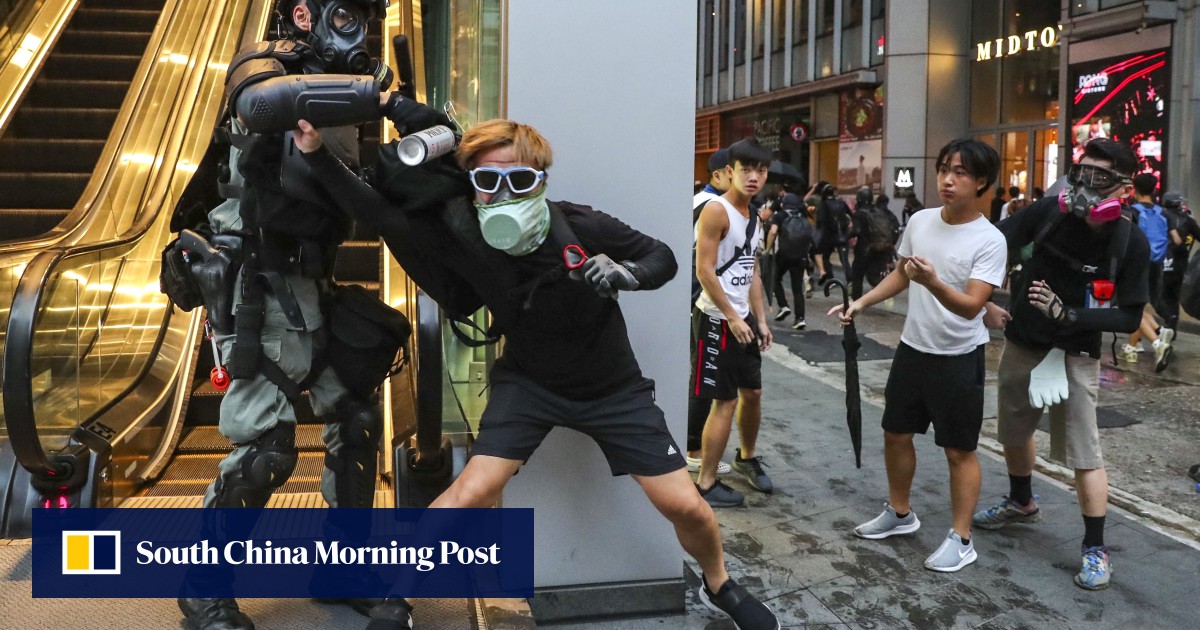At least 77 arrested over antimask law, as Hong Kong police say