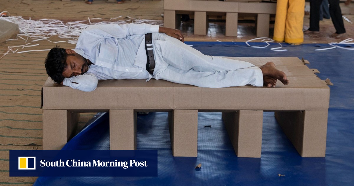 Coronavirus: India uses cardboard beds as hospitals run out of space