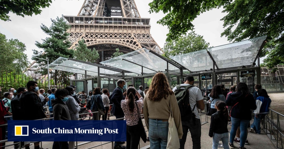 Eiffel Tower reopens; Covid pa...