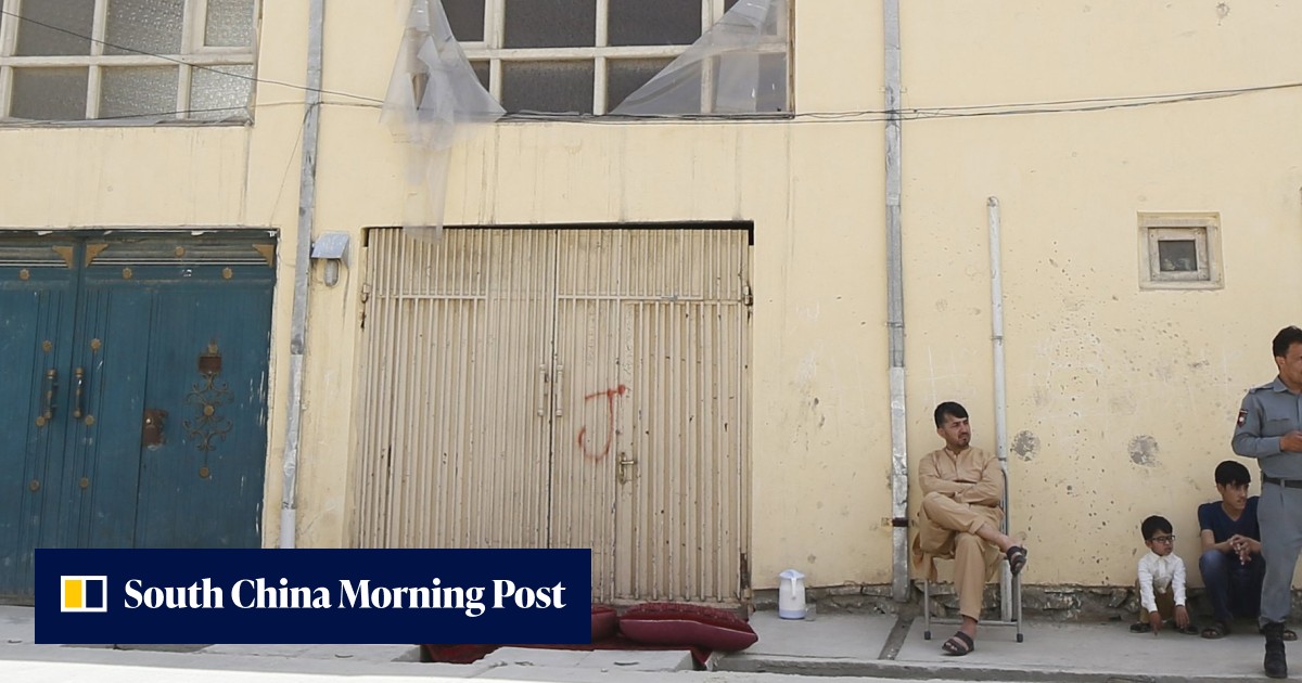 Kabul attackers behead guard, shoot German, kidnap Finnish woman