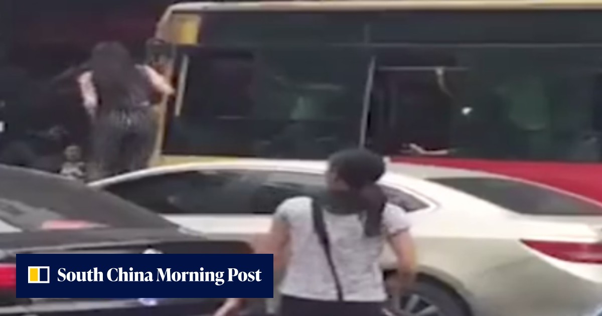 Angry Chinese driver climbs on car and through bus window for a brawl ...