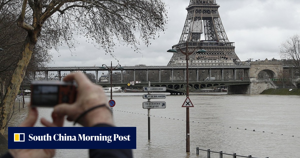 Drenched Paris braces for floods as swollen Seine River bursts its ...