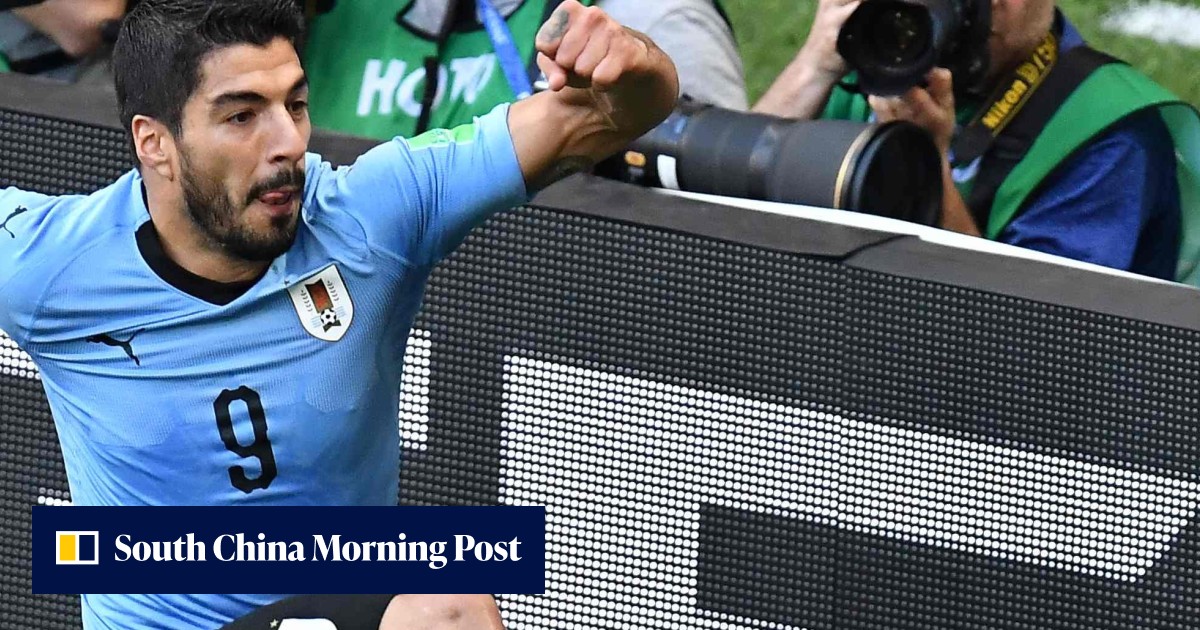 Luis Suarez marks 100th cap with goal to send Uruguay through to World ...
