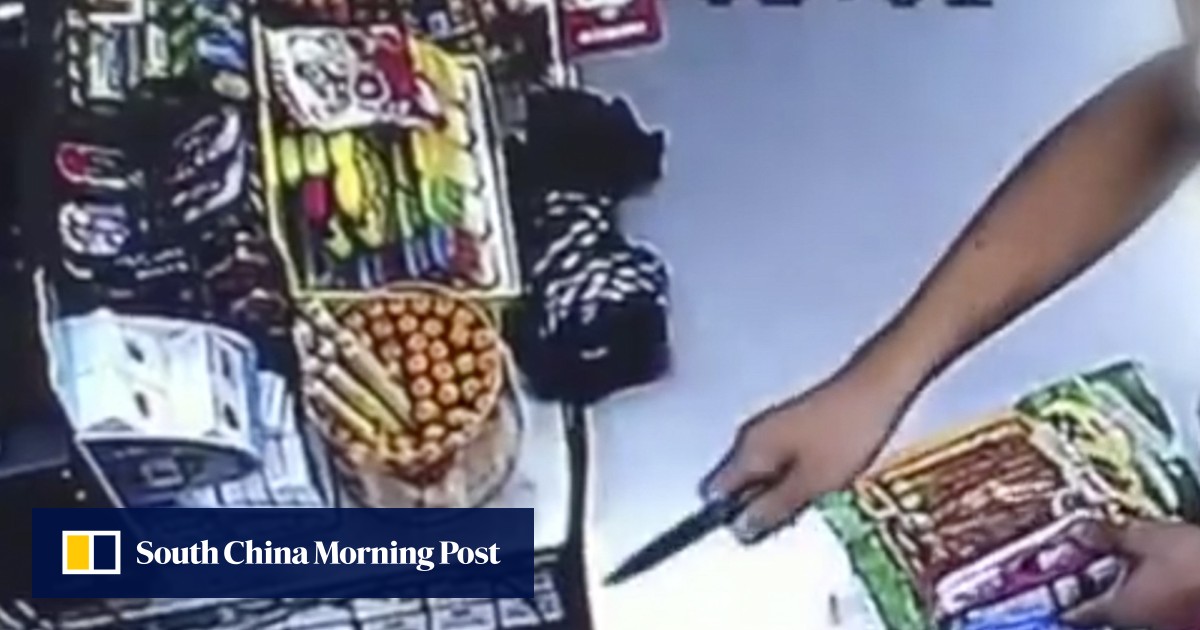 Gutsy Chinese Shopworker Refuses To Be Bullied By Knife wielding Robber 