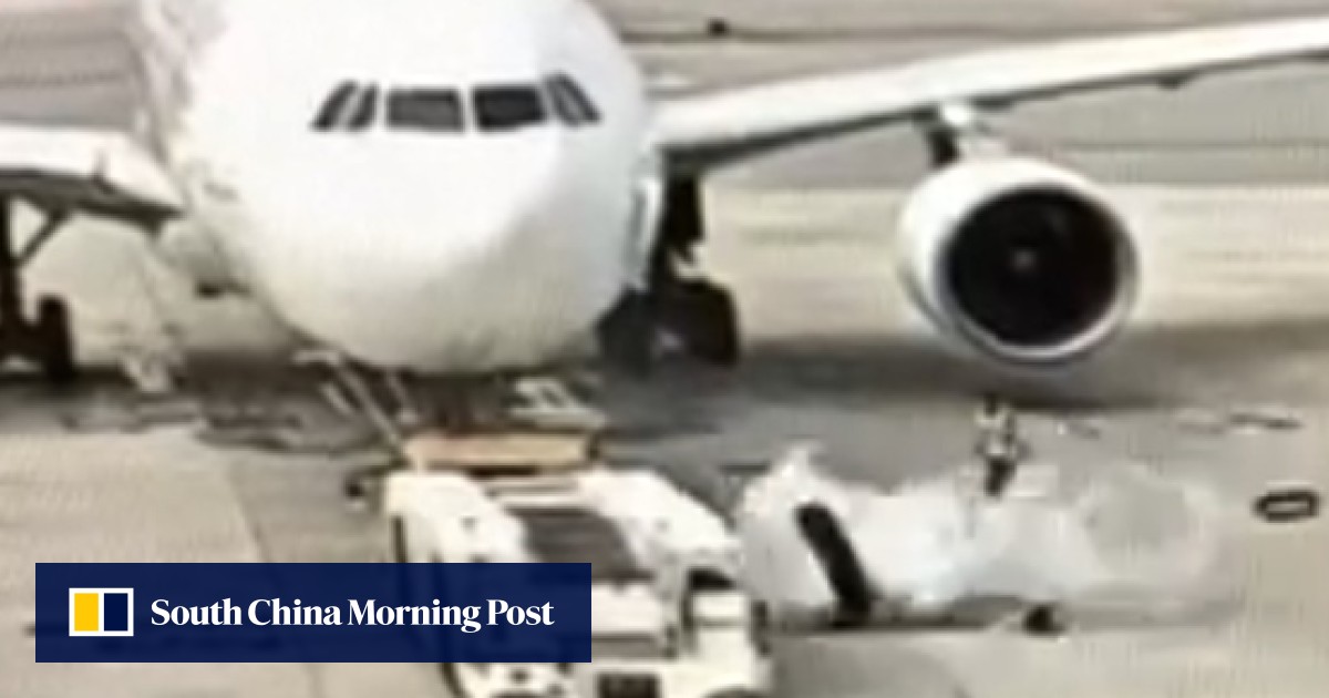Dramatic footage emerges of tyre explosion on aircraft tug at Hong Kong airport as plane