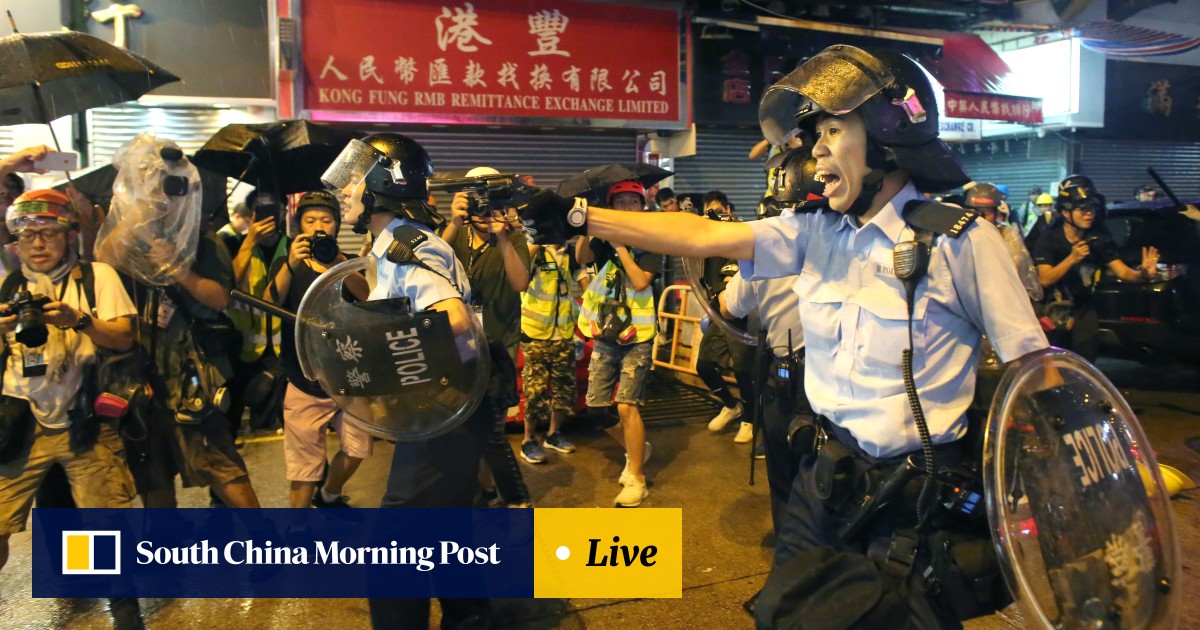 As it happened shot fired as police draw revolvers after officers are chased down street by