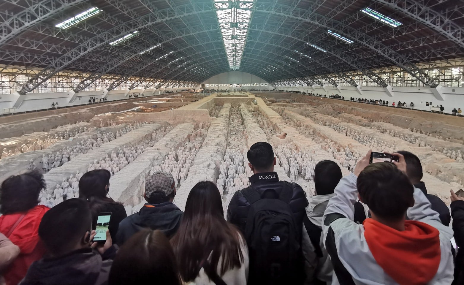Visitors look at terracotta warriors at Emperor Qinshihuang’s Mausoleum Site Museum in Xian. The Emperor Qinshihuang Mausoleum and Terracotta Warriors were included in the World Heritage list by Unesco in 1987. Photo: Xinhua