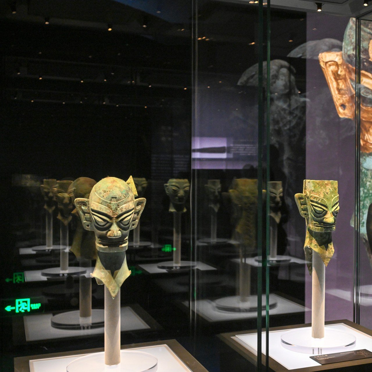 A visitor views the “Ancient Shu Civilisation of the Sanxingdui and Jinsha Sites” exhibition at the National Museum of China in Beijing on January 18. A Chinese team says it has solved some mysteries related to crimson beads found in Sanxingdui. Photo: Xinhua