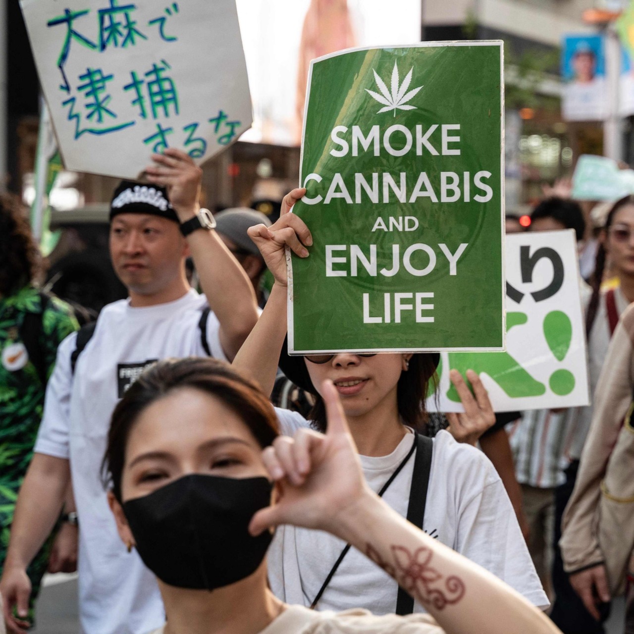 People take part in a march in Tokyo in 2023 calling for the legalisation of cannabis. Photo: AFP