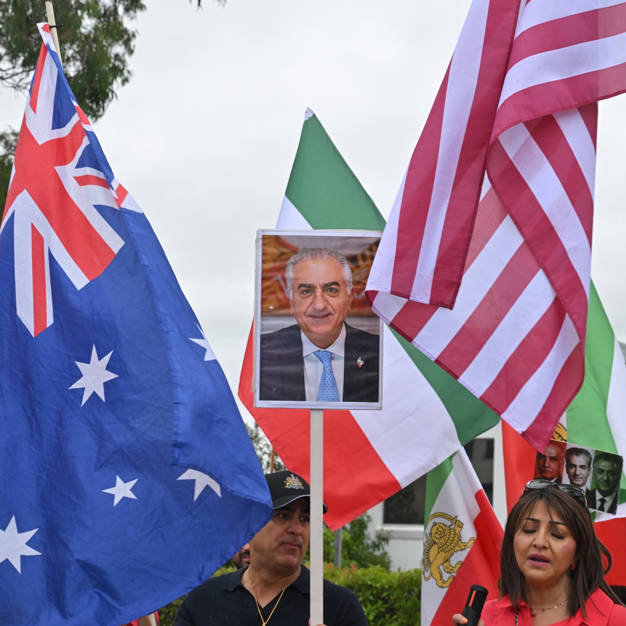 Members of the Iranian diaspora in Australia celebrate US and Israeli military strikes on Iran outside Iranian embassy in Canberra on March 1. Photo: EPA