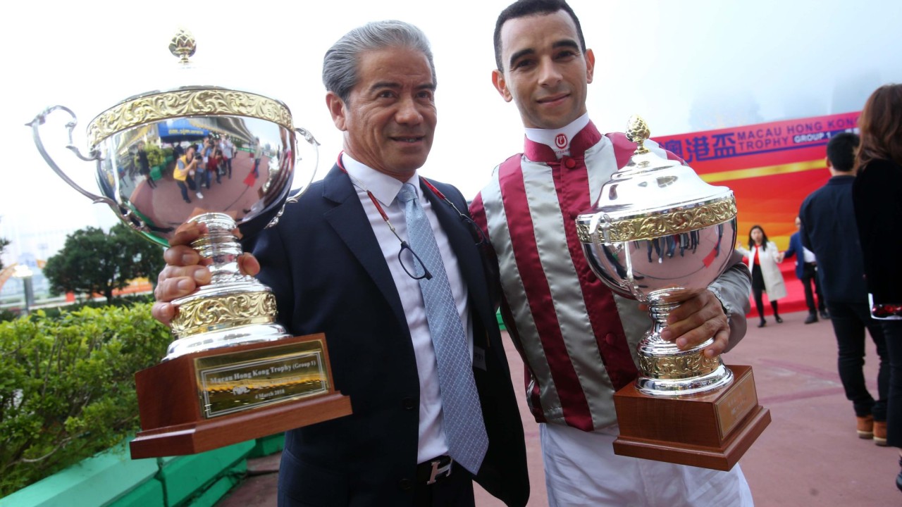 Trainer Tony Cruz and jockey Joao Moreira win the 2018 Macau Hong Kong Trophy with Romantic Touch.