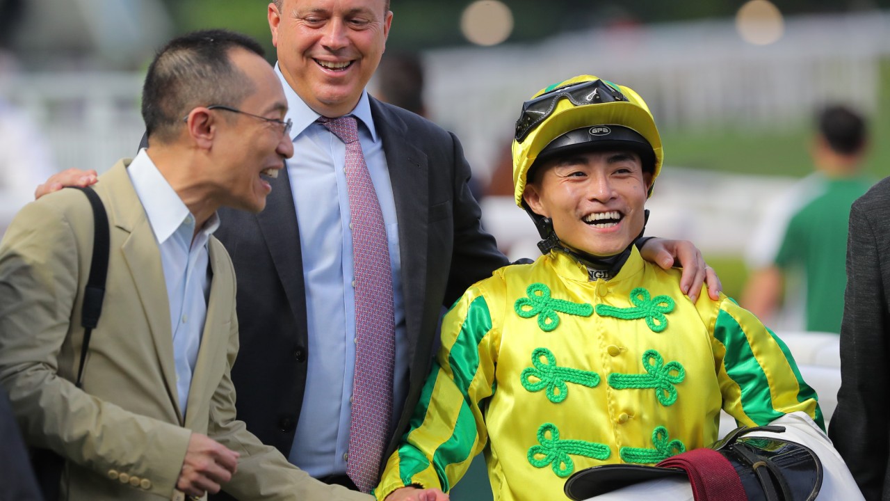 Caspar Fownes celebrates with Keith Yeung and connections after Sky Heart’s win at Sha Tin on Saturday.