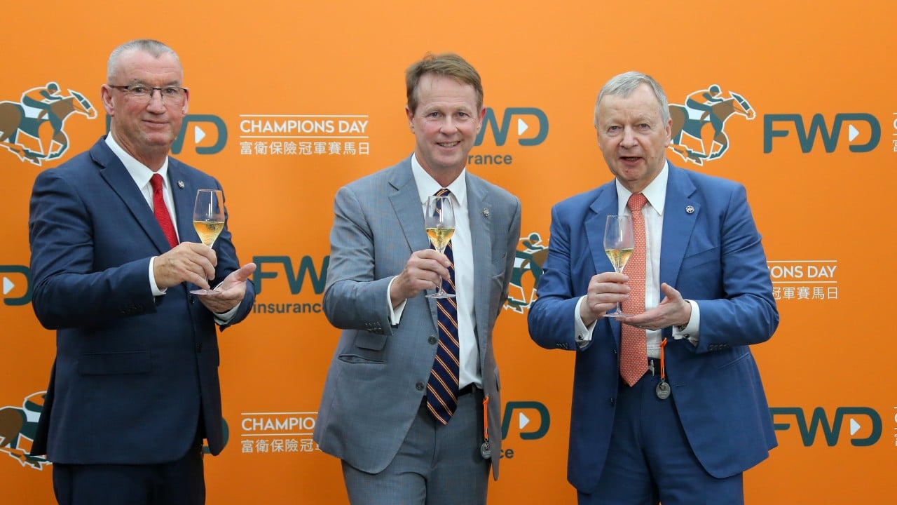 Jockey Club officials Greg Carpenter (left), Andrew Harding and Winfried Engelbrecht-Bresges toast Champions Day. Photos: Kenneth Chan