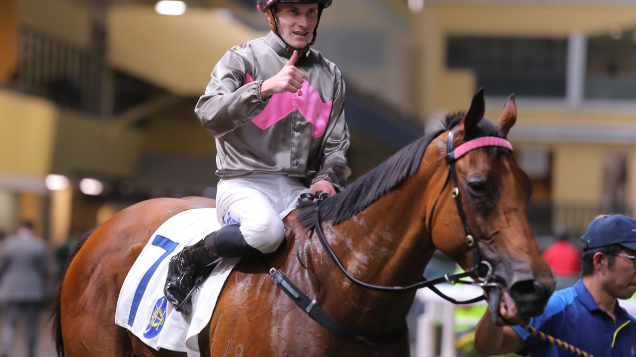 Luke Ferraris gives the thumbs up after guiding Setanta to victory at Happy Valley.