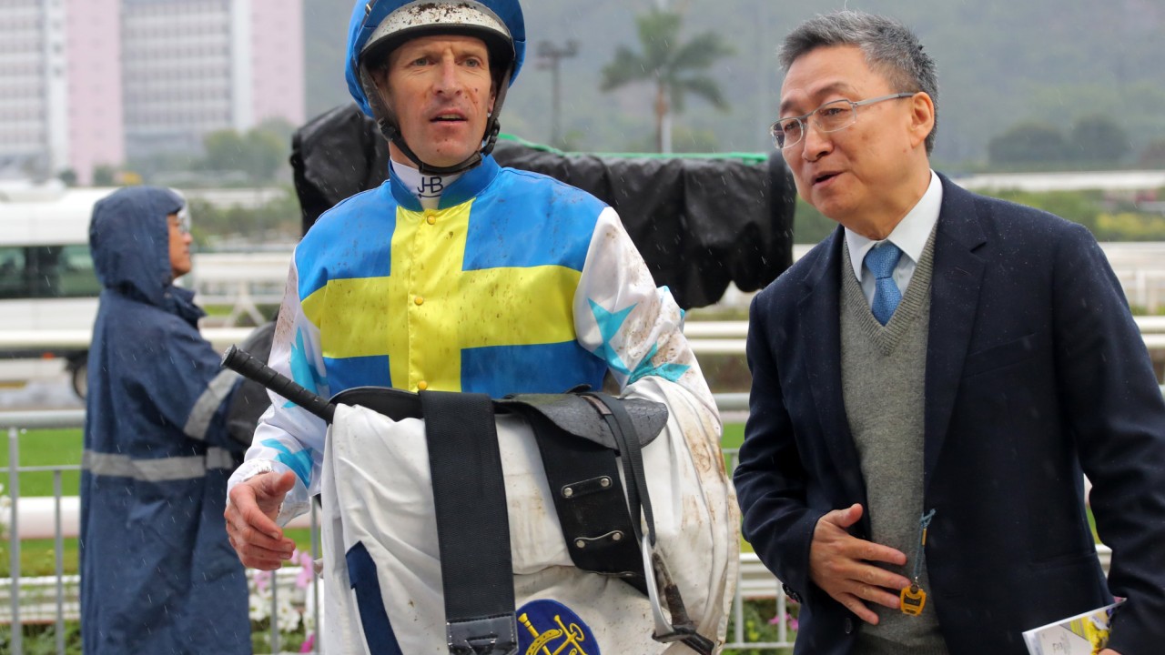 Jockey Hugh Bowman and trainer Francis Lui return to the weighing room after Patch Of Theta’s first win.
