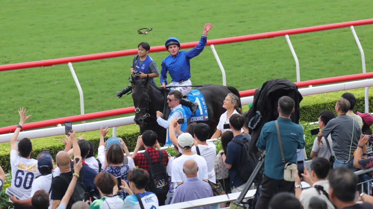 William Buick tosses his goggles into the Sha Tin crowd after booting home Rebel’s Romance.