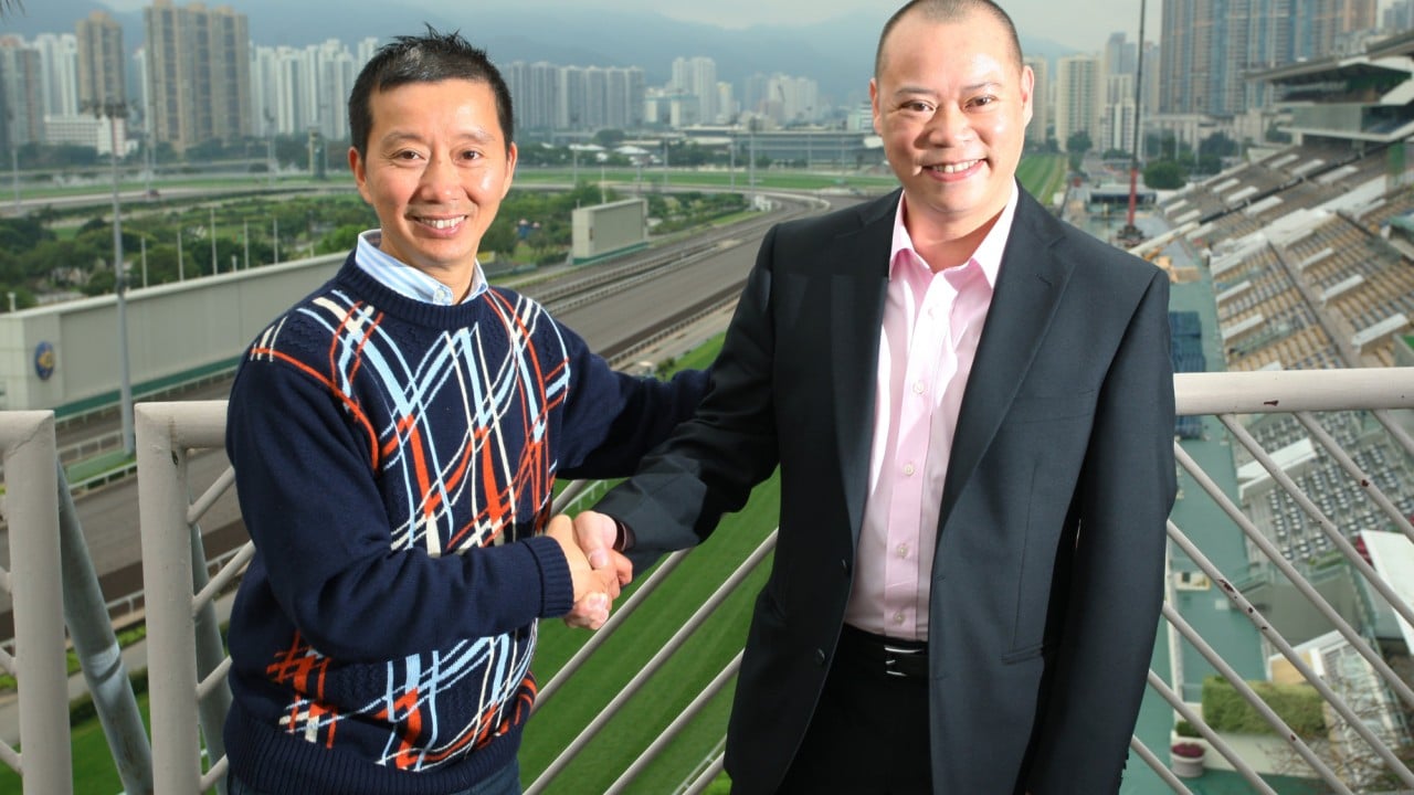 Benno Yung (left) and Chris So pose for the press after being announced as new trainers in 2013.